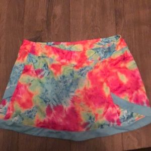A tie dye KIDS golf skort.